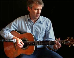 Tom Bishop Playing His Ovation Acoustic Guitar