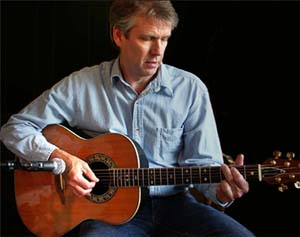 Tom Bishop Playing His Ovation Acoustic Guitar